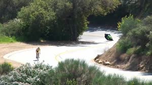 Biker crashes in front of police