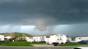 Large Tornado Forms Behind Trailer Park