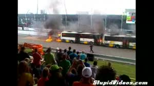 Car Drives Through Burning Buses