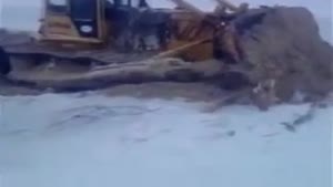 Bulldozer Falls Through Ice