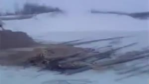 Bulldozer Falls Through Frozen Lake