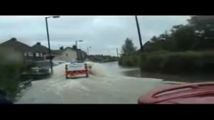Police Van Gets Stuck In The Flood