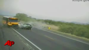 Raw Video Car Hits School Bus Head-On