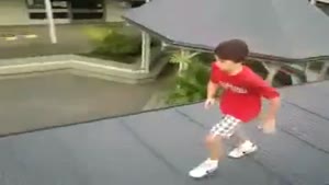 Kid Jumps From One Roof Through Another