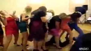 Man Goes Through Bridesmaids Train On His Back