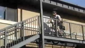 Security Officer Rides Bike On Stairs
