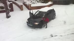 Woman Gets BMW Unstuck from Snow