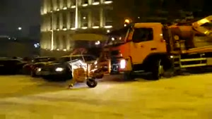 Snowplow Slides Into Car