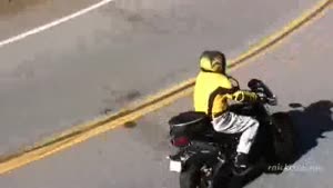 Motorcycle Crash Throws Rider Over Rail