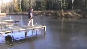 fat guy dives into frozen lake