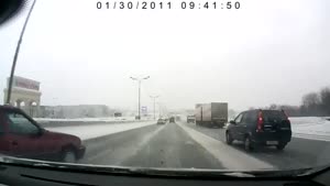 Driver Loses Control On Slippery Road