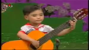 Chinese Toddlers Play On Big Guitars