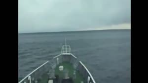 Boat Going Over The Tsunami Before Hitting The Coast