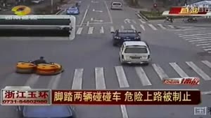 Man Driving Two Bumper Cars Down The Street In China
