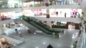 Man Saves Little Boy Falling Off Escalator