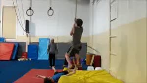 Climbing A Rope While Hula-Hooping