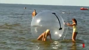 Blonde Bikini Girl Struggling With Beach Game