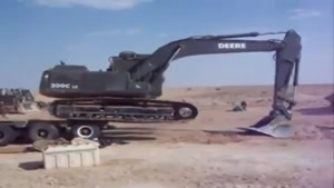 Excavator Falls Off Truck