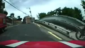 Scooter Trying To Go Backwards On A Bridge