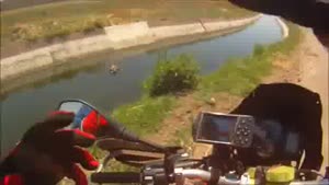 Motorcyclist Saves Calf From Drowning
