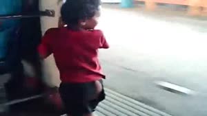 Parenting Fail - Kid Swinging Outside The Train