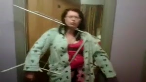 Woman Has Her Head Stuck Between The Clothes Horse