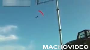 Parachutist Flies Into Barn