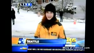 Sledder Interrupts News Report