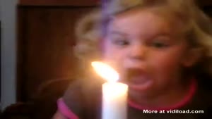 Little Girl Has Trouble Blowing Out The Candle