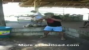 Man Peels Coconut With His Teeth