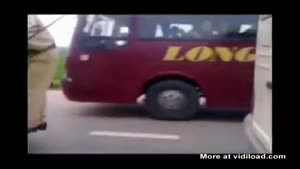 Police Officer Holds On To Window Wipers