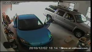 Woman Has A Hard Time Driving Out Of Her Garage