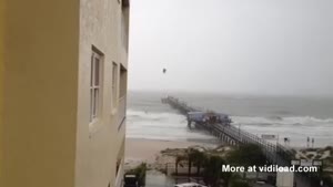 Kite Surfer Rides The Waves During Tropical Storm