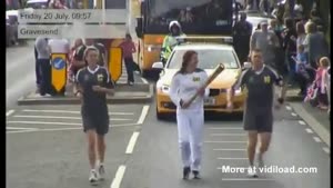 Idiot Tries To Steal The Olympic Torch