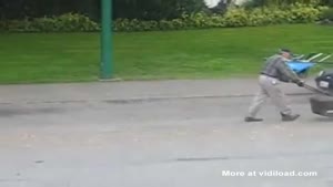 Guy Uses The Lawnmower To Mow The Asphalt
