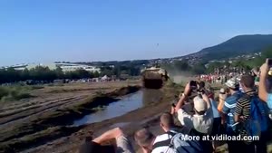 Unsuspecting Crowd Gets Muddy Surprise