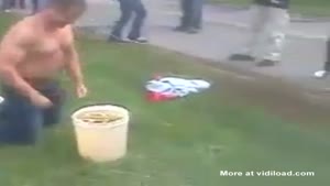 Crazy Guy Puts His Head In A Bucket Of Urine