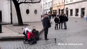 Toddler Helps Street Performer