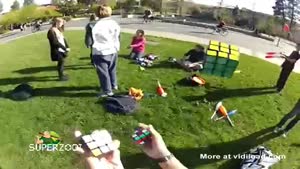 Solving Three Rubik Cubes While Juggling