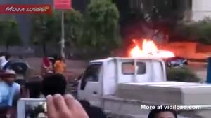 People Watch Car On Fire