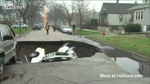 Hole In The Ground Swallowing Cars