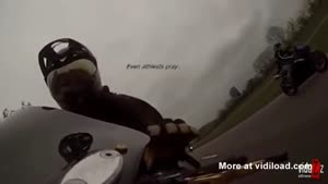 Biker Driving Underneath Huge Truck