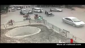 Biker Fall Into Huge Hole In The Ground