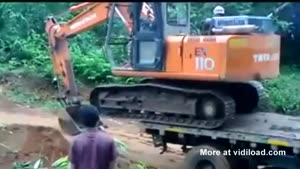 Excavator Falls Off Truck
