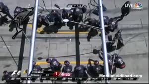 Pit Crewman Gets A Face Full Of Tyre