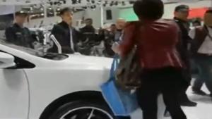 Asian Woman Scratches Expensive Car