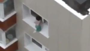Baby Playing On Edge Of Balcony Window