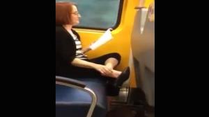 Woman Eating Her Foot On The Train