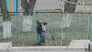 Drunk Tries To Get Through Fence