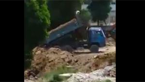 Truck Almost Vanishes In Sinkhole